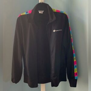 Black with multicolour Champion coat with stripes on the sleeve. Size medium.